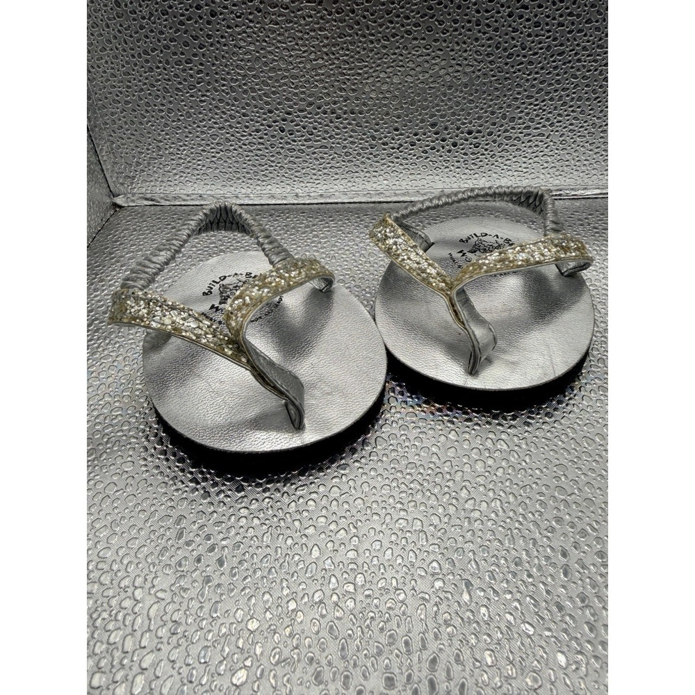 Build-A-Bear Workshop silver glitter sandals for a 16-inch stuffed animal.